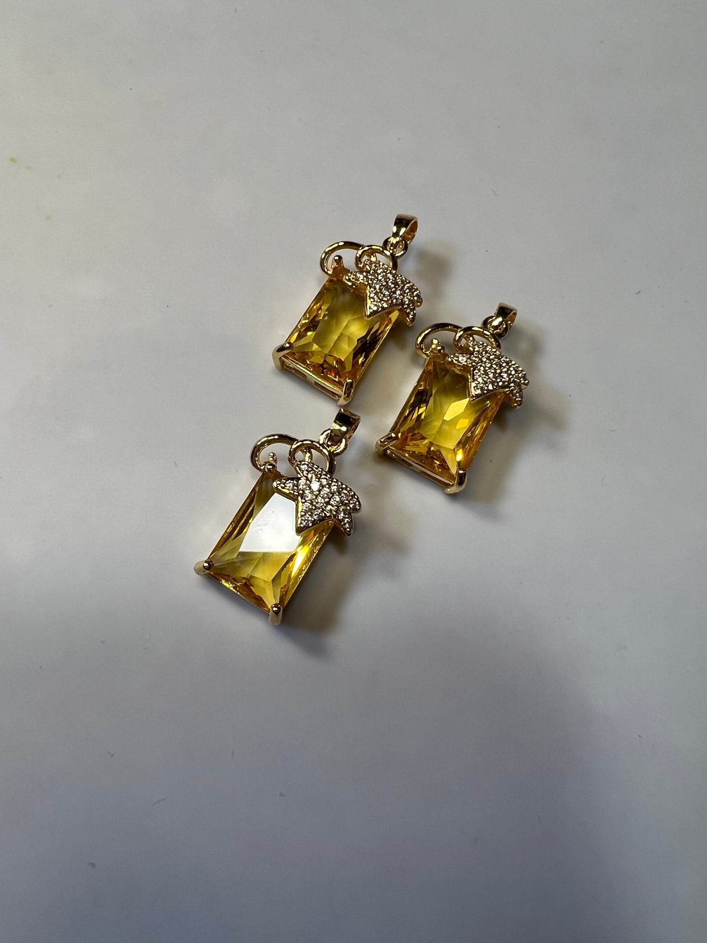 Citrine colored Zircons set in Copper alloy Pendants