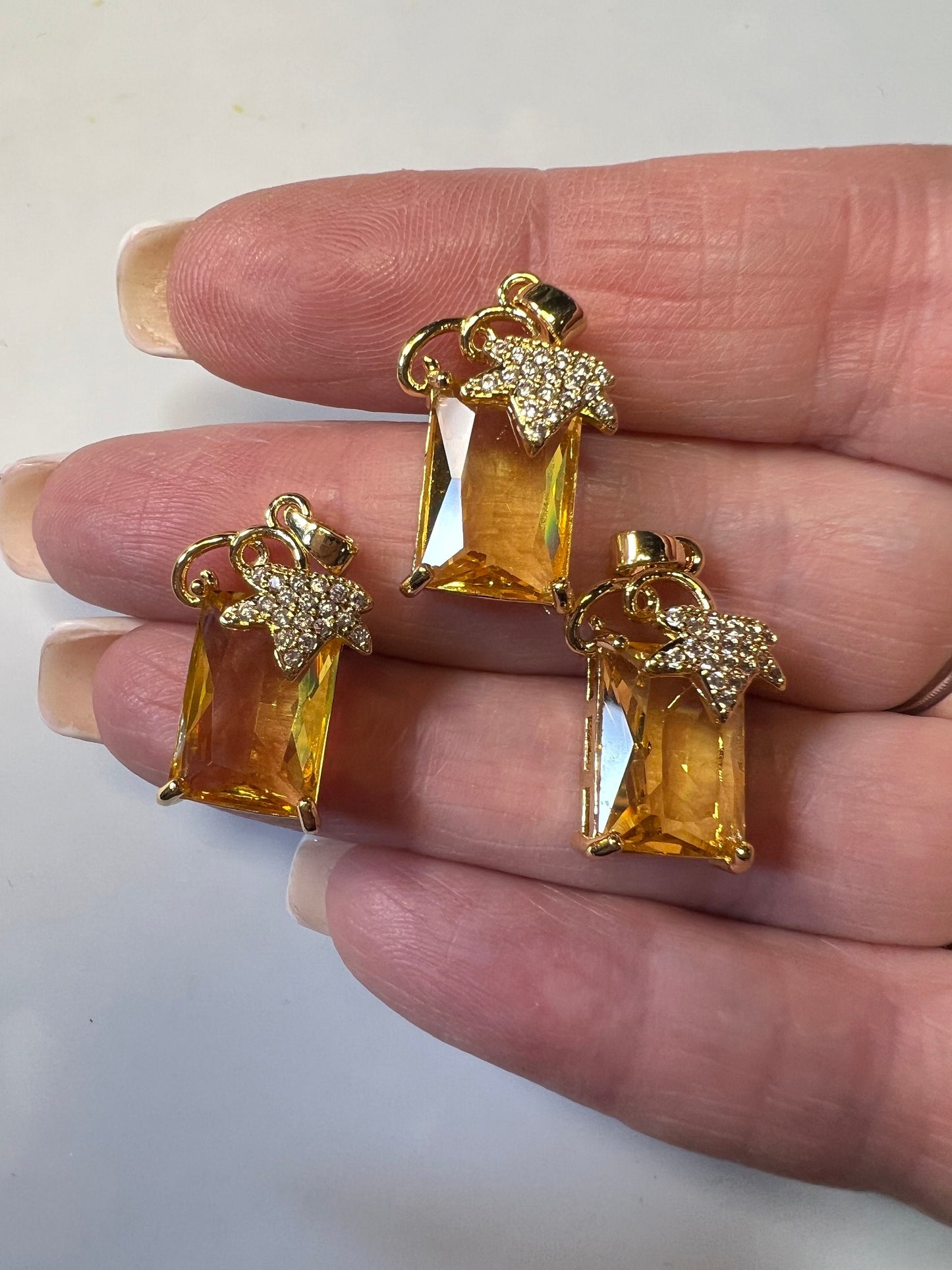 Citrine colored Zircons set in Copper alloy Pendants