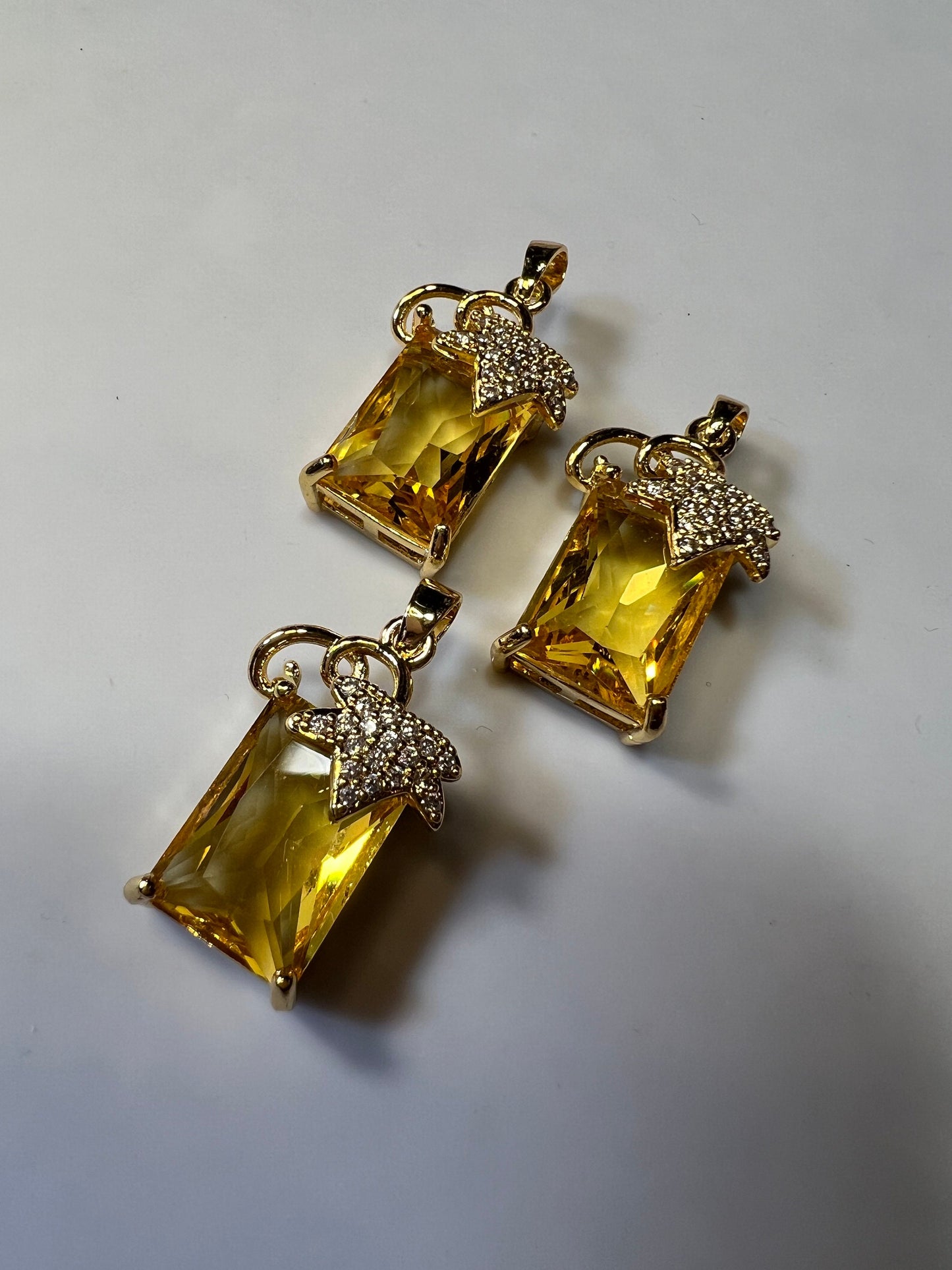 Citrine colored Zircons set in Copper alloy Pendants